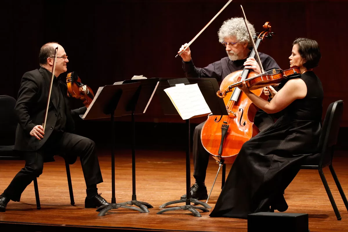 Violinist Mikhail Shmidt, violist Susan Gulkis Assadi and cellist Walter Gray perform string trios by Dick Kattenburg and Géza Frid. Credit: Ben VanHouten